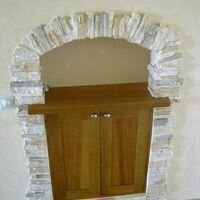 Фото арка в искусственном рваном декоративном камне в интерьере квартиры